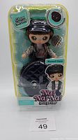 Front view of Na! Na! Na! Surprise Glam Series Maxwell Dane doll in original packaging showing doll with accessories and branding.