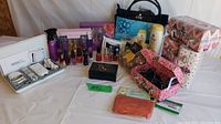 Full overview of the beauty lot including Philips Lady Shave box, nail polish bottles, lotions, cosmetic bags, and decorative boxes.
