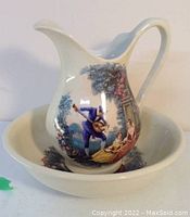 Single water pitcher placed inside the wash basin, showing scenic detailed prints on each item.
