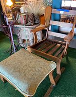 Solid wood chair and footstool with cushion shown on low green carpet