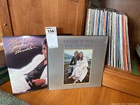 Photo showing Michael Jackson 'Thriller' and The Carpenters 'Close To You' albums with a large stack of vinyl LPs in the background