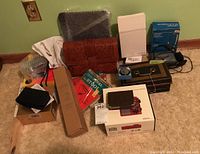 Photo showing the full lot including purse, camera, Walkman, stools, cash box, coin bank, screwdriver, and radio box