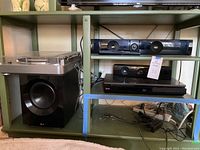 Turntable and LG subwoofer placed on lower and side shelves respectively