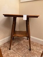 Side view showing table legs and lower shelf