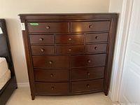 Front view of dresser showing all 14 drawers.