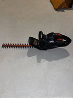 Full side view of Black & Decker hedge trimmer showing 16-inch blade and handle.
