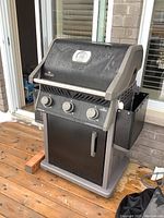 Front exterior view of Napoleon Rogue grill on deck