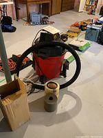 Full view of the Craftsman shop vacuum with hose, cylindrical filters, and cardboard box.