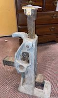 Right-side view of Simplex car jack showing lifting post, lever mechanism, and base