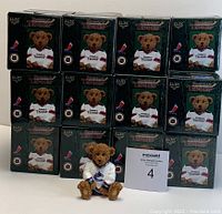 Photo of 24 boxed Powerplay Teddies ceramic bears and one displayed out of box.