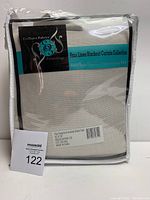 Packaged faux linen blackout curtain in beige color, labeled Exclusive Fabrics, size 50x120 inches.