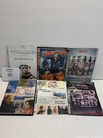 Photo showing all seven DVD cases lined up including Beasts of No Nation, Sharknado, Orange is the New Black, Ten Items or Less, Live Crime, and The Dark Knight.