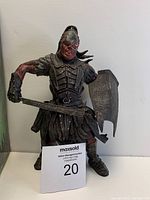 Front view of Lurtz figure showing figure detail, armor, sword and shield held by the figure.