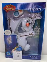 Front view of Olaf Interactive Wall Character in original packaging showing Olaf figure, Disney Frozen Wall Friends branding, and note about speaking and lighting features.