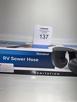 Box of Camco Standard RV Sewer Hose showing product name and indication of being a 10 ft hose.