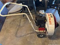 Side view of blower on wheels with handle