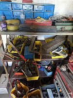 Photo showing four shelves with assorted tools, containers and toolboxes including labeled blue multi-drawer organizer on top shelf, hand tools and hardware in yellow plastic containers on lower shelves