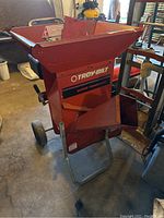 Front side view of Troy-Bilt Super Tomahawk wood chipper showing the hopper and wheels.