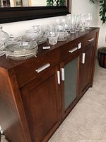 Front view of buffet with three drawers and three doors