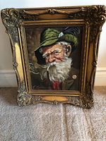 Full view of the oil painting of an elderly German man in a carved gold frame