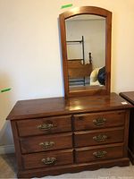 Full view of pine dresser with six drawers and attached mirror, showing size and finish