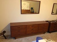 Full view of dresser with mirror mounted above