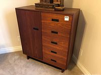 Front view of teak highboy cabinet showing overall design and layout