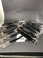16 black choker necklaces, various styles, individually bagged with gold-tone closures and one rhinestone bridal hair band