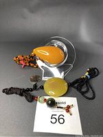 Lot of 3 gemstone necklaces: lab amber teardrop pendant, double beads agate with pink cross accent, and round yellow agate pendant with black beads.