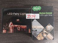 Two boxed LED light strips side by side. One box labeled LED Fairy Light, the other labeled Motion Sensor LED Light Strip by Meguila.