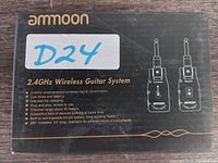 Closed box showing brand and basic features of Ammoon 2.4 GHz Wireless Guitar System with transmitter and receiver illustration.