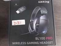 Front of box showing wireless gaming headset image, model name BL100 Pro, brand Gikking, and USB adapter illustrated on upper left corner.