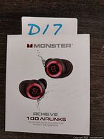 Box front showing black and red earbuds with MONSTER branding and model Achieve 100 Airlinks.