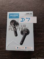 Front of the retail box shows black true wireless earbuds with charging case, model Life P2 by Soundcore, mentions 40-hour playtime.