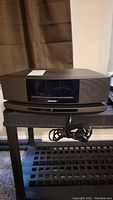 Front view of Bose Wave music system IV showing display and speaker grilles