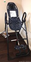Full frame and seat viewed upright against a wall