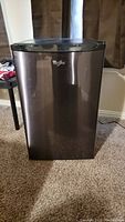 Front view of stainless steel Whirlpool mini refrigerator
