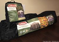 Coleman branded bags for the tent and rainfly, packaging shows tent setup and branding.