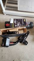 Full view of the Smittybilt XRC winch unit with steel cable, black housing, and branding label.