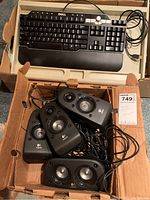 Dell SK8135 black corded keyboard with wrist rest inside cardboard box