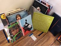 Photo showing a variety of art and photography books arranged side by side with visible covers including Culture Trip and a book with a camera on the cover.