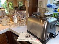 Photo of stainless steel Cuisinart toaster with control buttons and cord