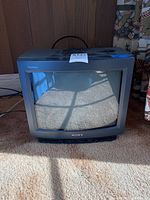 Front view of the Sony Trinitron 13 inch CRT TV showing its curved screen and Sony logo on front bezel.