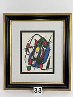 Full view of framed lithograph with double mat and vintage black and gilt frame
