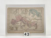 Full view of the antique hand-coloured Mediterranean map mounted on white board with photo corners, showing entire map area with some age toning.