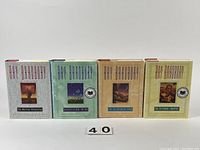 Four hardcover books by Ray Bradbury displayed upright showing front covers with titles The Martian Chronicles, Dandelion Wine, The Illustrated Man, and The October Country.