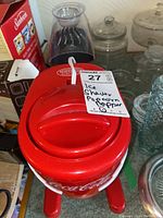 Photo of red Coca-Cola Nostalgia Electric ice shaver with clear handle and white logo