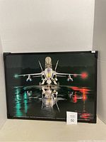 Front view of framed Boeing F/A-18C Hornet photo showing aircraft and runway reflection
