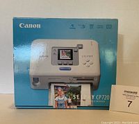 Front of the original Canon Selphy CP720 printer box showing product image and branding.