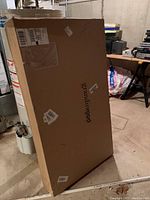 Sealed box with label 'grandinroad', indicating the new in box condition of the Amalfi bench.